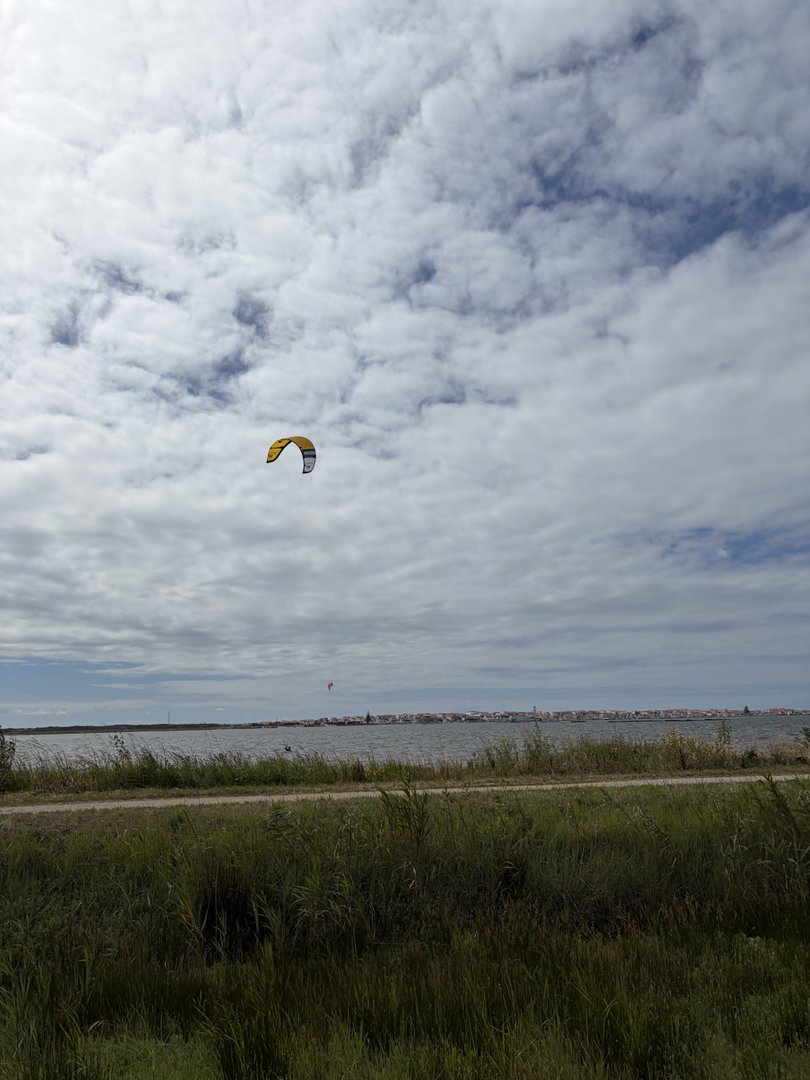View from the small field launching area toward Ervas with a kite in the distance